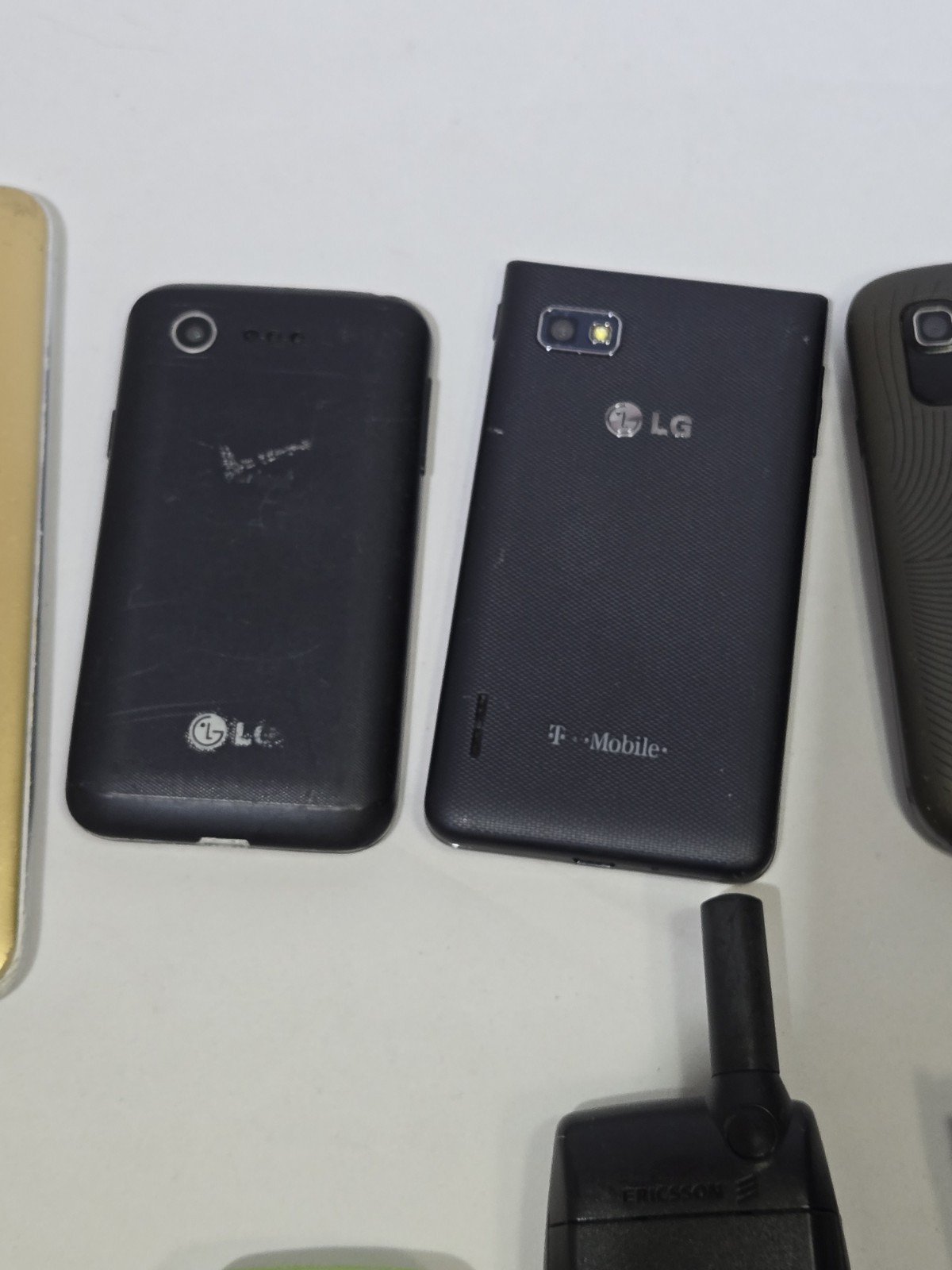Lot of 9 Mixed Cell Phones & Accessories LG Samsung Ericsson – For Parts