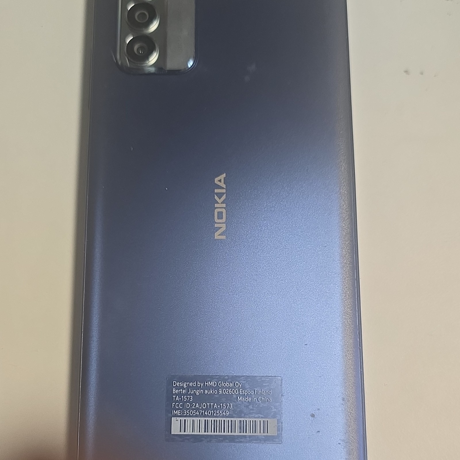 Nokia 100 iOS Smartphone 64GB Blue for T-Mobile TA-1573 Rear View Shown