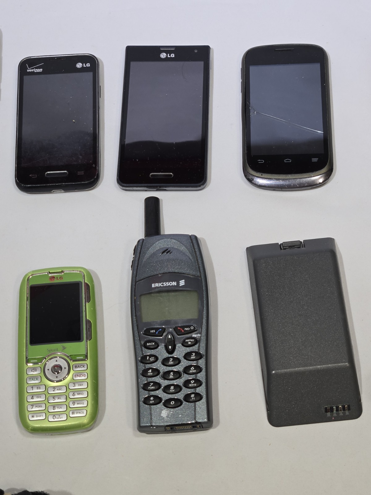 Lot of 9 Mixed Cell Phones & Accessories LG Samsung Ericsson – For Parts