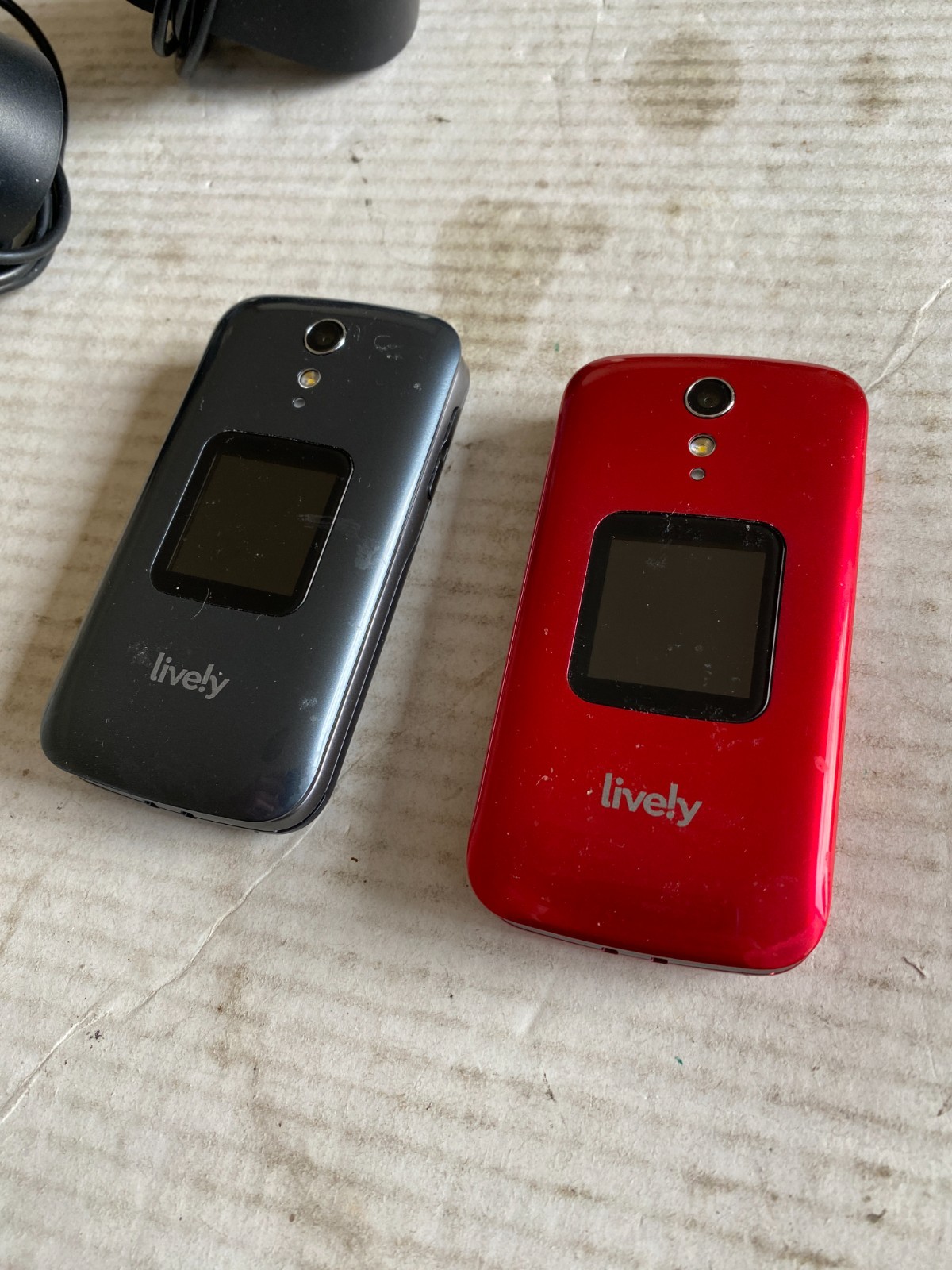 (2) pre-owned Lively Jitterbug flip phones red + gray w/ docking stations