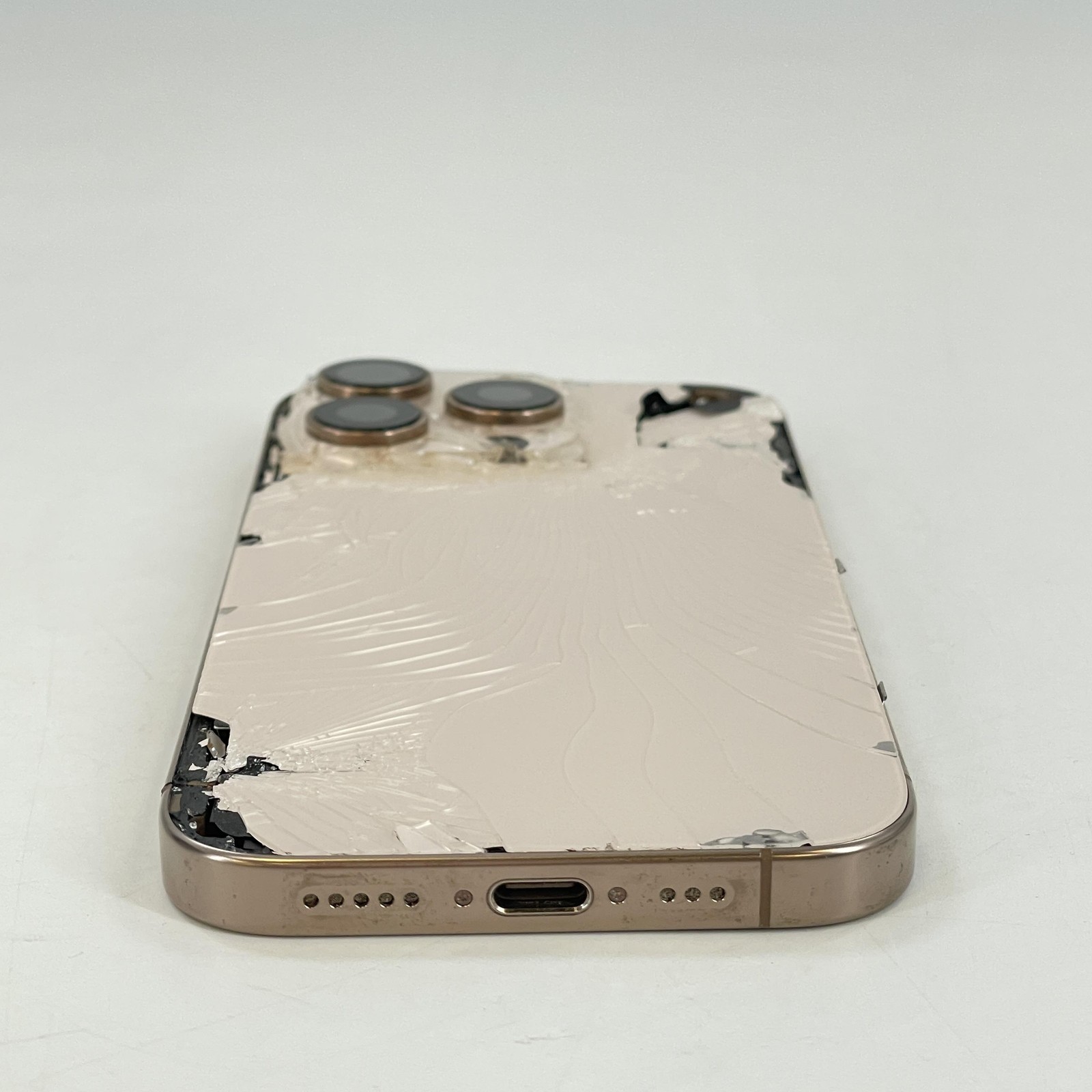 Apple iPhone 16 Pro Desert Titanium 256GB AT&T – Cracked Front/Back w LCD Bleed