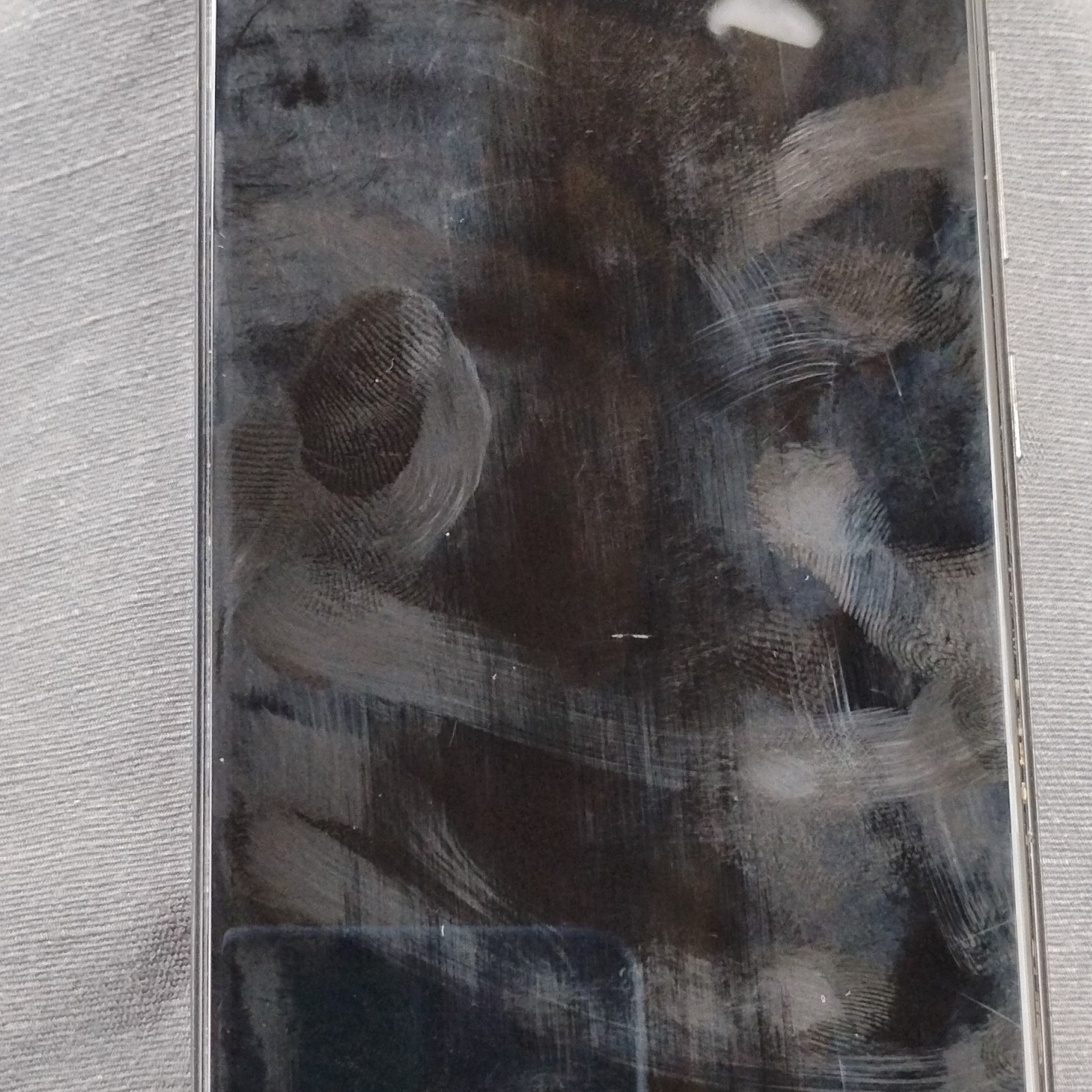 Silver Bar Smartphone with Geometric Pattern Back and Dual Camera