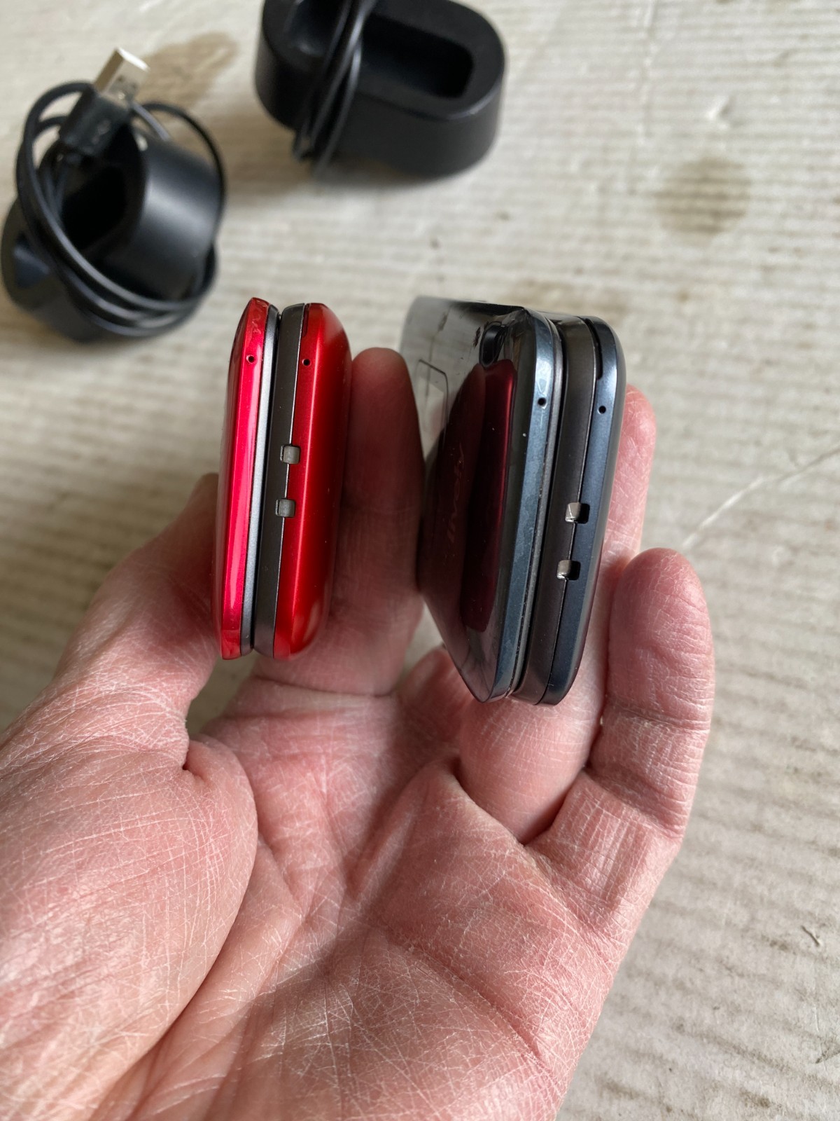 (2) pre-owned Lively Jitterbug flip phones red + gray w/ docking stations