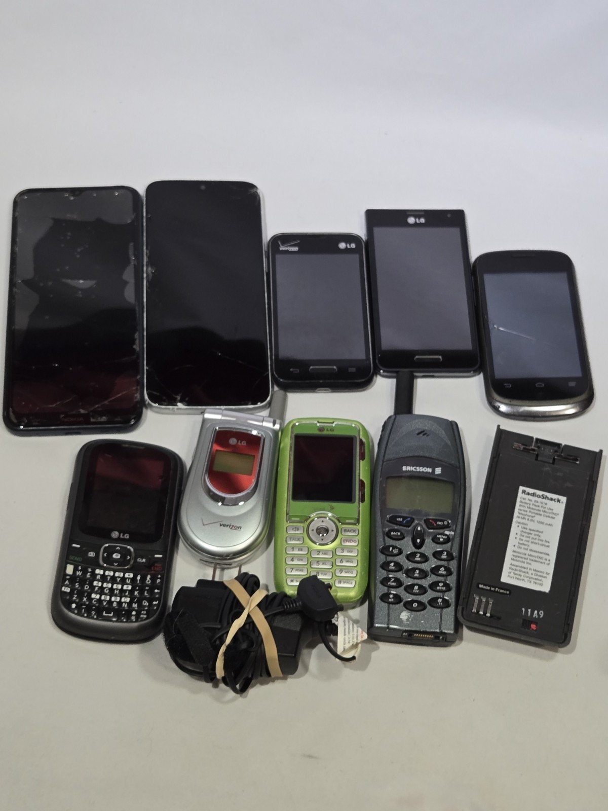 Lot of 9 Mixed Cell Phones & Accessories LG Samsung Ericsson – For Parts