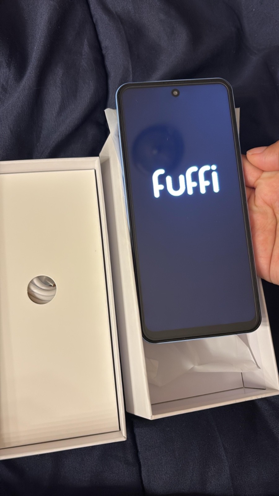 Is a fuffy iPhone, is purple with kind of blue has 3big cameras, is not used,